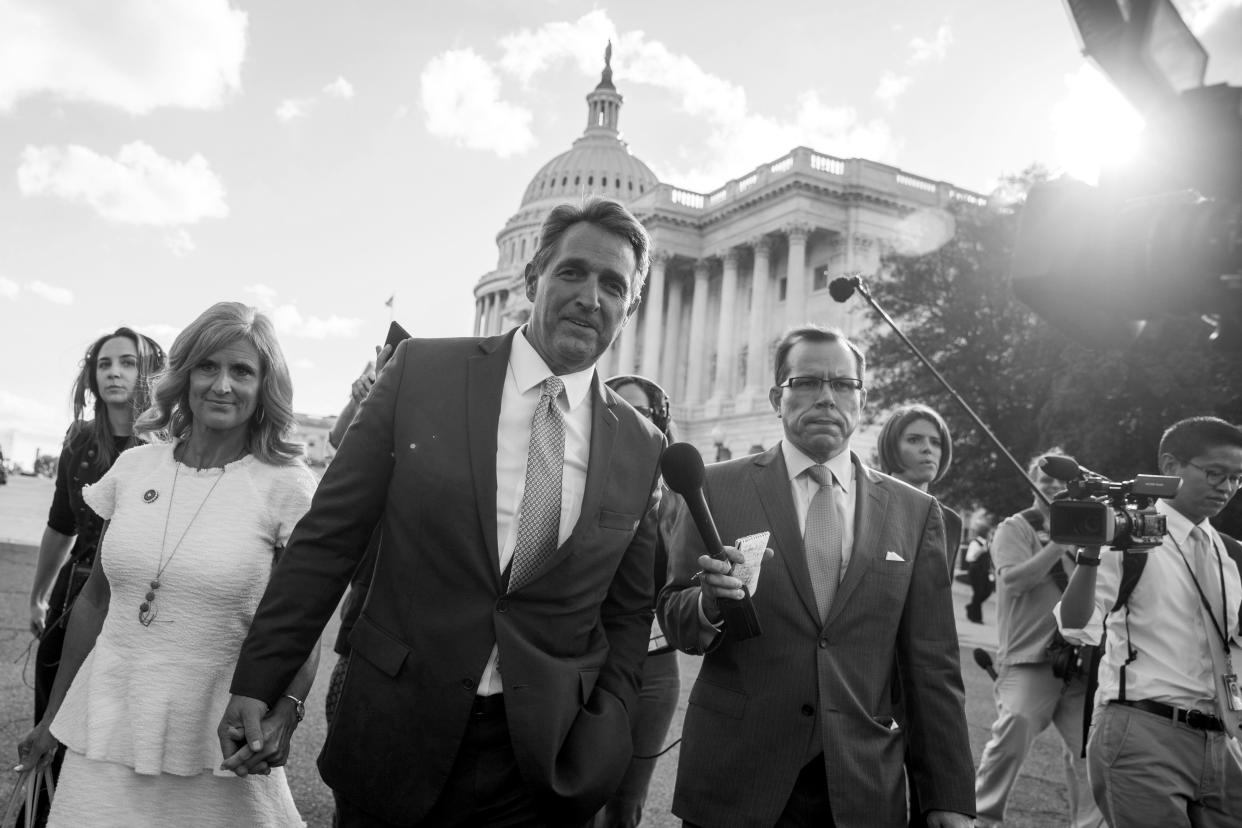 Sen. Jeff Flake, R-Ariz., accompanied by his wife, Cheryl, leaves the Capitol in Washington on Oct. 24, 2017, after announcing he won’t seek reelection in 2018. (Photo: Andrew Harnik/AP)