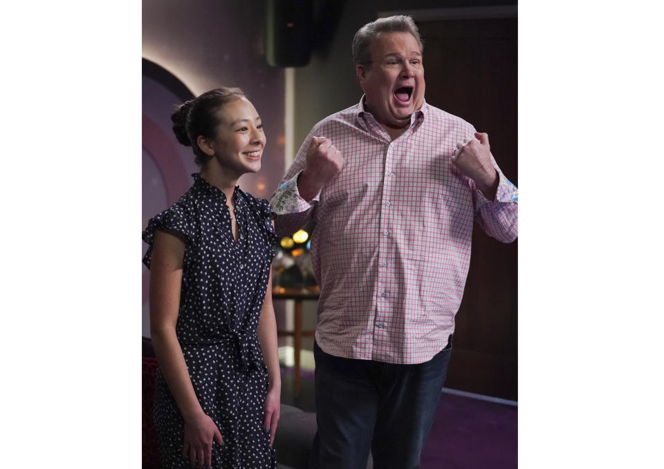 This image released by ABC shows Aubrey Anderson-Emmons, left, and Eric Stonestreet in a scene from "Modern Family." The popular comedy series ends its 11-season run with a two-hour finale on Wednesday. (Eric McCandless/ABC via AP)