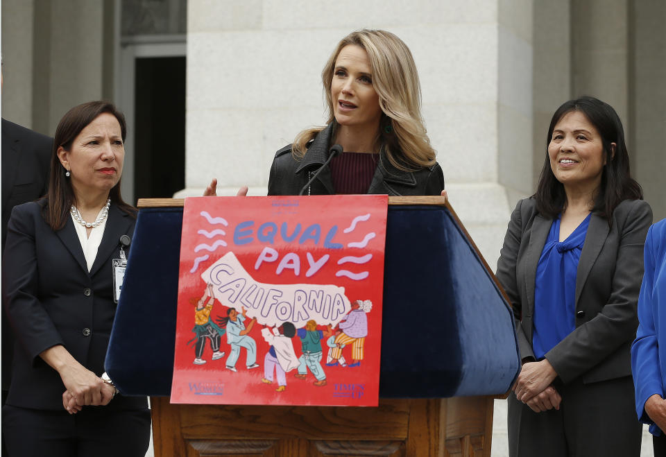 FILE -- In this April 1, 2019 file photo California first partner Jennifer Siebel Newsom, center, the wife of Gov. Gavin Newsom, joined others to to announce the #EqualPayCA campaign, in Sacramento, Calif. Siebel Newsom has shunned the traditional title of "first lady" and is focusing on women's issues including equal pay and expanding family leave. (AP Photo/Rich Pedroncelli, File)