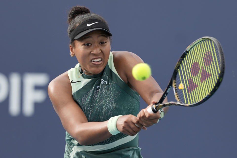 Naomi Osaka, of Japan, hits a return to Caroline Garcia, of France, during the Miami Open tennis tournament, Sunday, March 24, 2024, in Miami Gardens, Fla. (AP Photo/Lynne Sladky)