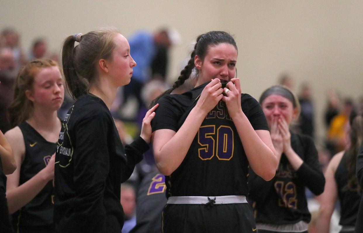 OLSH's Emma Ficorilli (50) is consoled by a fellow teammate after OLSH falls to River Valley 44-38 in the PIAA 3A Semifinals game Monday night at Kiski Area High School in Leechburg, PA.