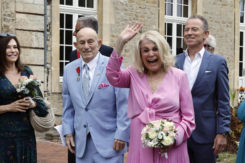 US WWII veteran Harold Terens, 100, left, and Jeanne Swerlin, 96, arrive to celebrate their wedding at the town hall of Carentan-les-Marais, in Normandy, northwestern France, on Saturday, June 8, 2024. Together, the collective age of the bride and groom was nearly 200. But Terens and his sweetheart Jeanne Swerlin proved that love is eternal as they tied the knot Saturday inland of the D-Day beaches in Normandy, France. (AP Photo/Jeremias Gonzalez)