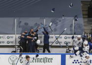 Tampa Bay Lightning team and staff celebrate after defeating the Dallas Stars to win the Stanley Cup in the NHL Stanley Cup hockey finals, in Edmonton, Alberta, on Monday, Sept. 28, 2020. (Jason Franson/The Canadian Press via AP)