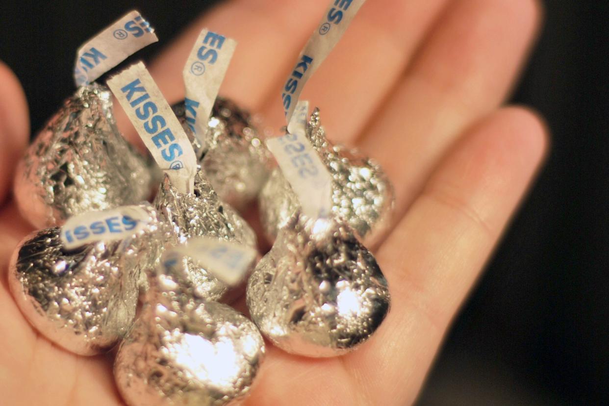 hand holding Hershey Kisses in palm