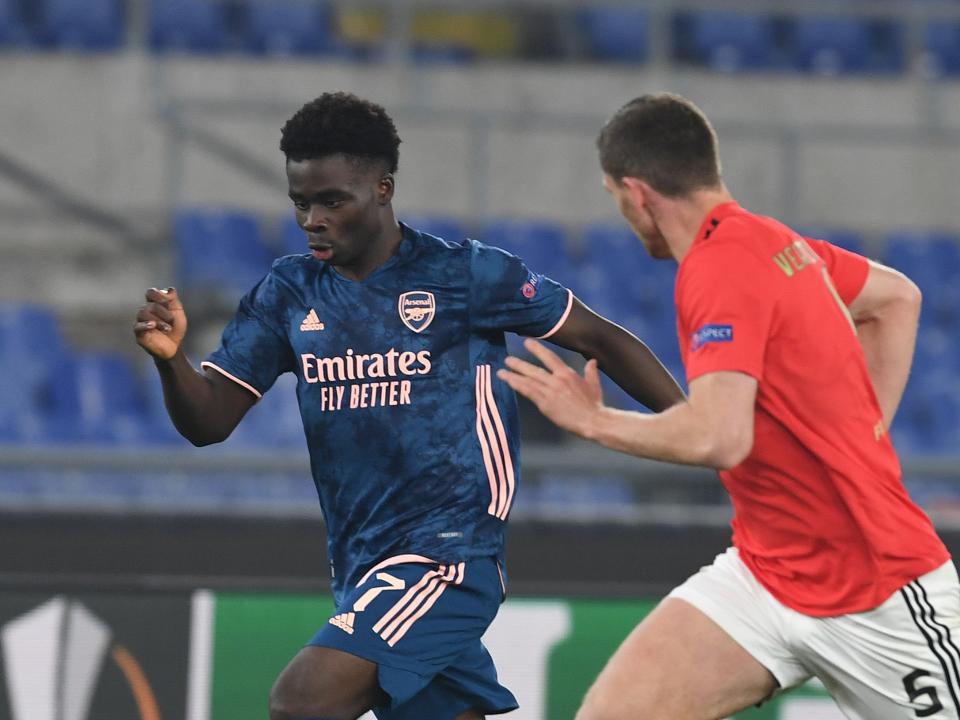 Goalscorer Bukayo Saka in action against Benfica in the first leg (Arsenal FC via Getty Images)