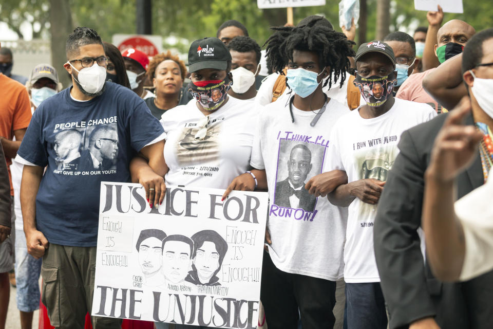 A group of protesters march from the Glynn County Courthouse to a police station after a rally to protest the shooting of Ahmaud Arbery, Saturday, May 16, 2020, in Brunswick, Ga. (AP Photo/Stephen B. Morton)