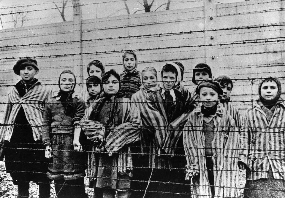 Children who survived the death camp are pictured shortly after the liberation. 