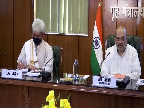 Home Minister Amit Shah (left) and Jammu and Kashmir Lieutenant Governor Manoj Sinha (right)