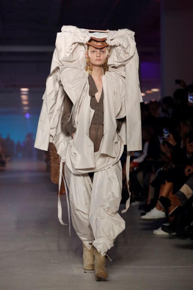 Model walks the Vivienne Westwood runway in a giant fish hat at