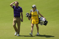 Jesse Mueller walks the fairway with his caddie and wife Jessie on the 17th hole during the first round of the PGA Championship golf tournament at Southern Hills Country Club, Thursday, May 19, 2022, in Tulsa, Okla. (AP Photo/Eric Gay)