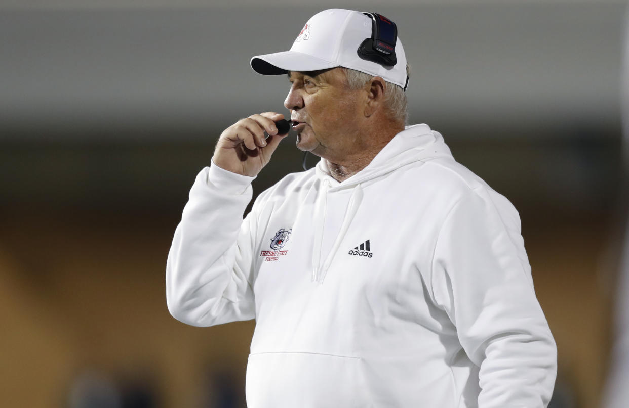 LOGAN, UT - OCTOBER 13: Head coach Jeff Tedford of the Fresno State Bulldogs talks into his headset during the second half of their game against the Utah State Aggies at Maverik Stadium on October 13, 2023 in Logan, Utah. (Photo by Chris Gardner/Getty Images)