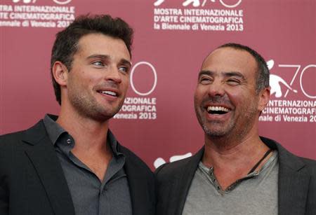 Actor Tom Welling (L) and director Peter Landesman (R) pose during a photocall for their movie "Parkland" at the 70th Venice Film Festival in Venice September 1, 2013. REUTERS/Alessandro Bianchi