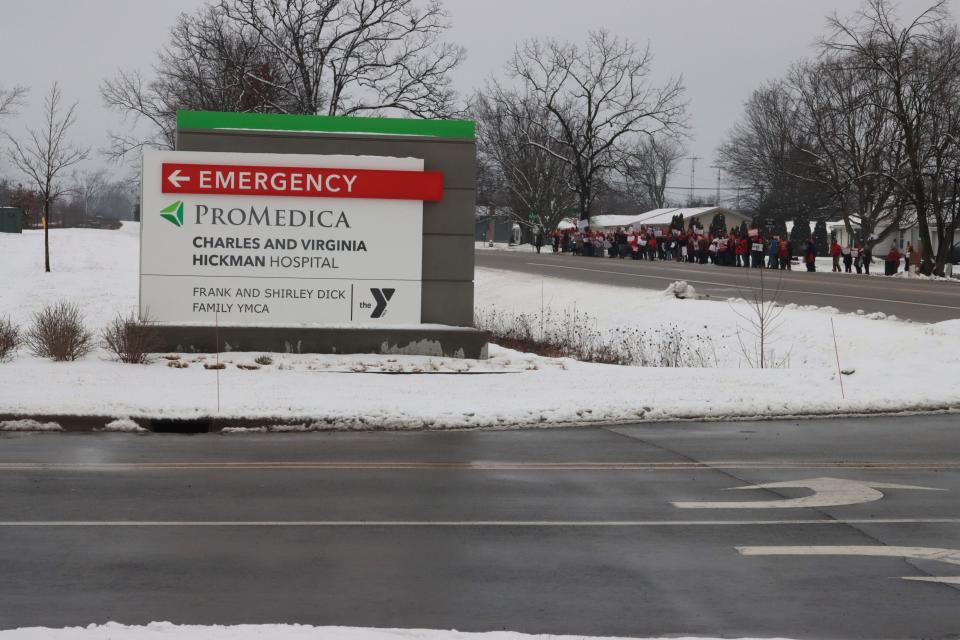 Nurses from ProMedica Charles and Virginia Hickman Hospital in Adrian are pictured participating in a "practice strike" Tuesday, Jan. 30, 2024, across M-52 from the hospital.