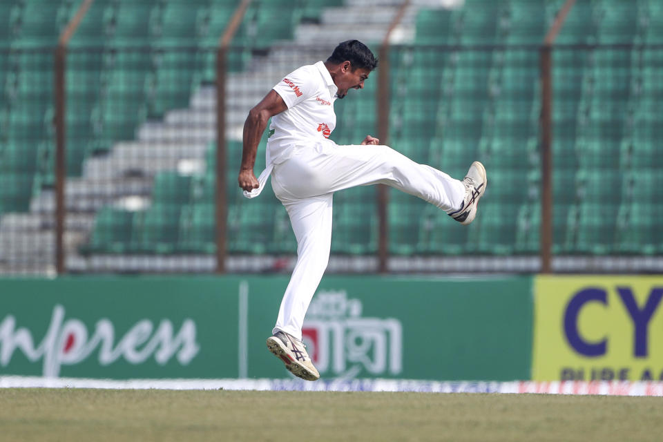 Bangladesh's Taijul Islam celebrates the wicket of India's Virat Kohli during the first day of the first test cricket match between Bangladesh and India in Chattogram, Bangladesh, Wednesday, Dec. 14, 2022. (AP Photo/Surjeet Yadav)