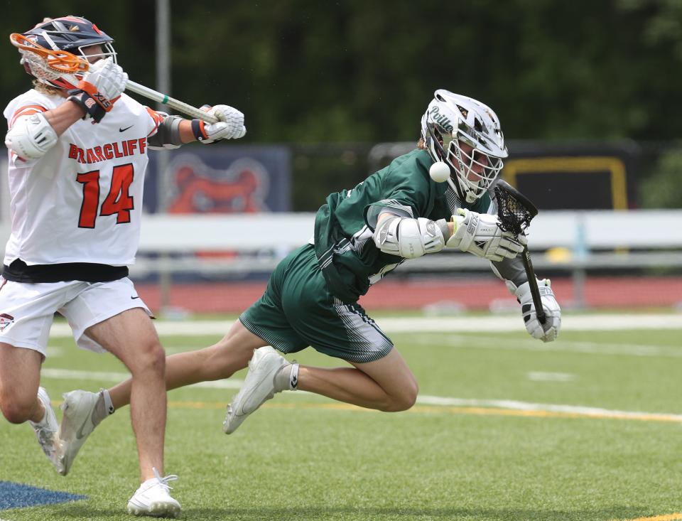 Pleasantville's Michael Hundzyski (1) battles a face-off with Briarcliff's Shane Dean (14) during boys lacrosse action at Briarcliff High School  May 13, 2023.  