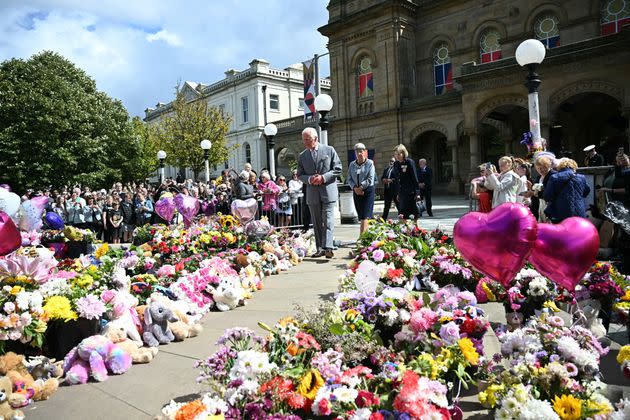 King Charles views tributes outside Southport Town Hall, during his Aug. 20 visit to meet with members of the local community, following a stabbing attack at a children's dance party in northwest England.