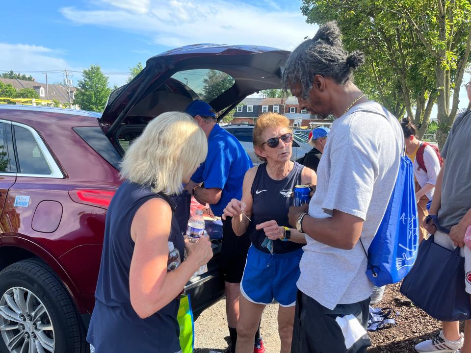 Dr. Sandra Gibney, center, and Lt. Gov. Bethany Hall-Long, left, show a Wilmington resident how to use new xylazine-fentanyl test strips.