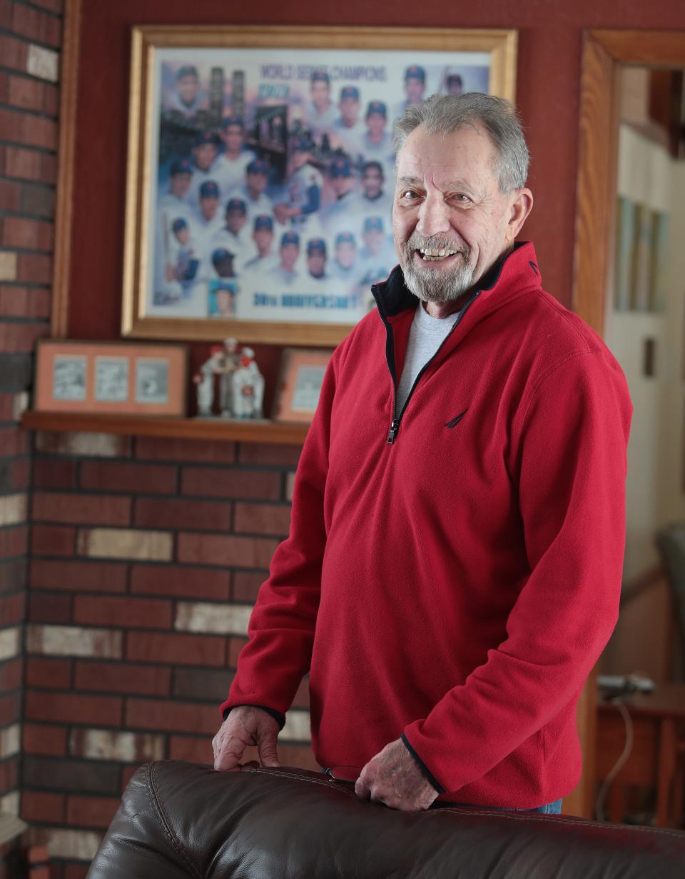 Former Major League Baseball pitcher Jack DiLauro stands near some of his memorabilia at his home in Malvern. He was a member of the 1969 World Series champion New York Mets.