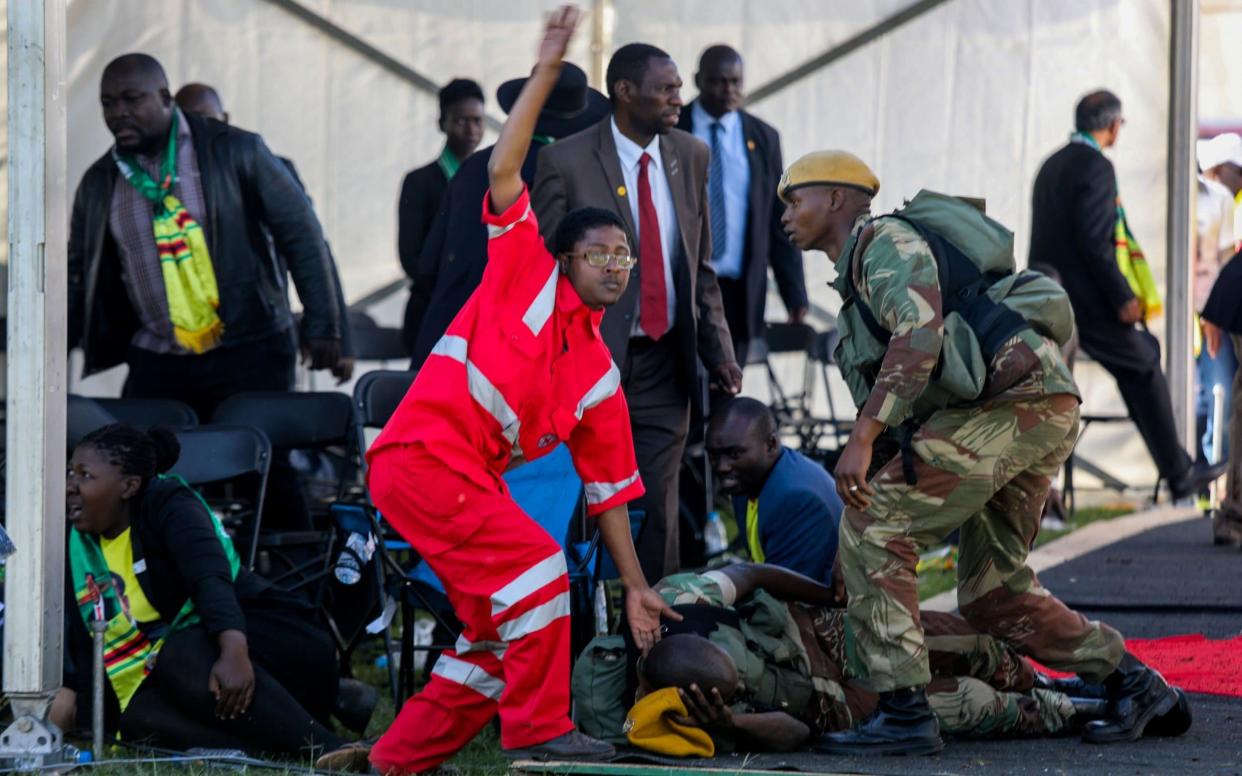 Medics attend to people injured in an explosion during a rally by Emmerson Mnangagwa  - REUTERS