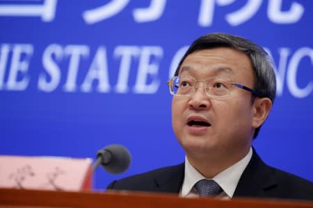 Chinese Vice Commerce Minister and Deputy China International Trade Representative Wang Shouwen attends a news conference in Beijing