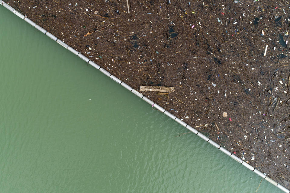 Aerial view of tons of waste floating on Lim river near Priboj, Serbia, Monday, Jan. 30, 2023. Plastic bottles, wooden planks, rusty barrels and other garbage dumped in poorly regulated riverside landfills or directly into the rivers accumulated during high water season, behind a trash barrier in the Lim river in southwestern Serbia. (AP Photo/Armin Durgut)