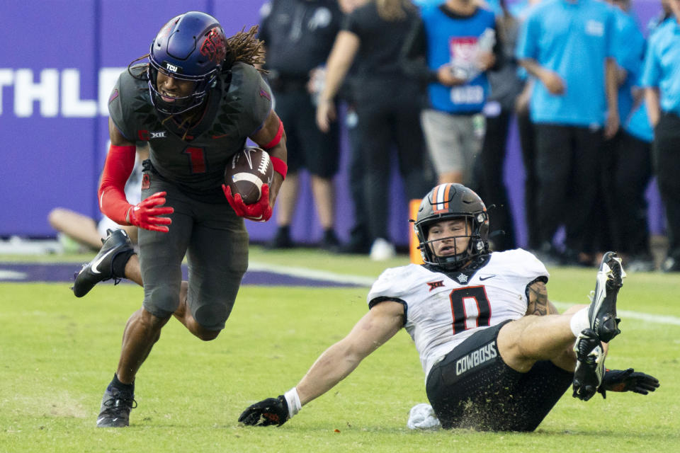 TCU wide receiver Quentin Johnston (1) runs with the ball against Oklahoma State in Fort Worth, Texas, Saturday, Oct. 15, 2022. (AP Photo/Sam Hodde)