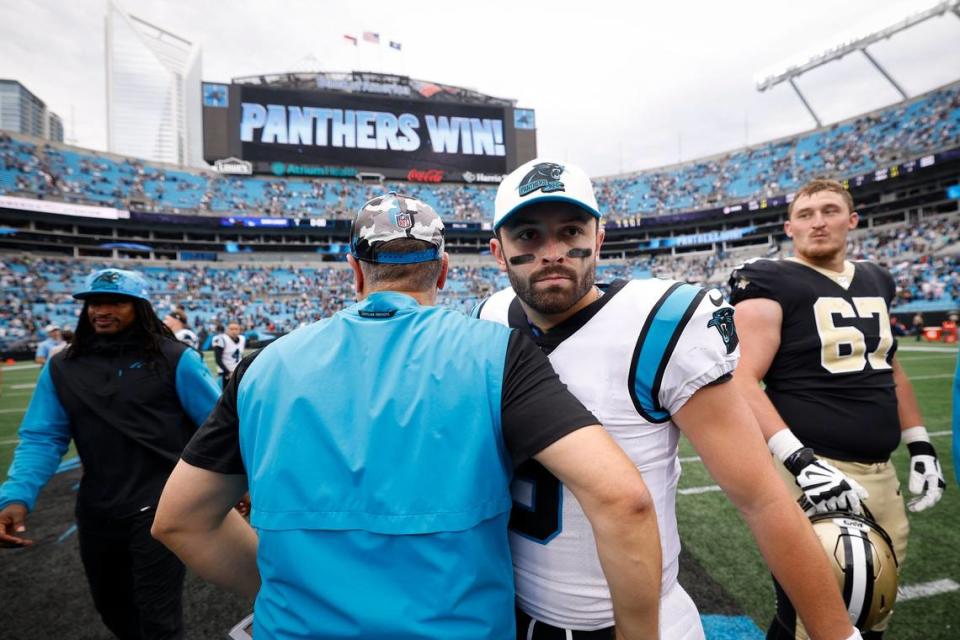 Carolina Panthers head coach Matt Rhule shakes hands with Carolina Panthers quarterback Baker Mayfield (6) after the Panthers defeated the New Orleans Saints 22-14 on Sept. 25, 2022. It was the duo’s only win together, and now both have been released from the organization.