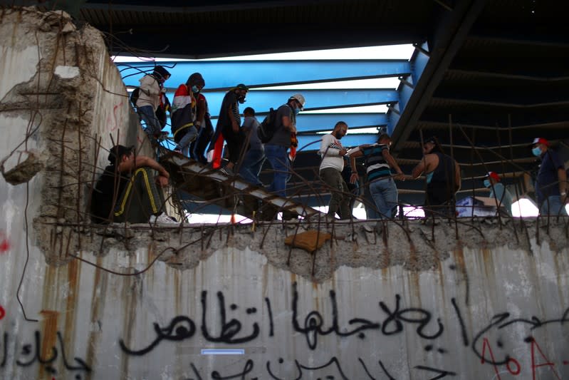 Iraqi demonstrators are pictured inside the high-rise building, called by Iraqi the Turkish Restaurant Building, during anti-government protests in Baghdad