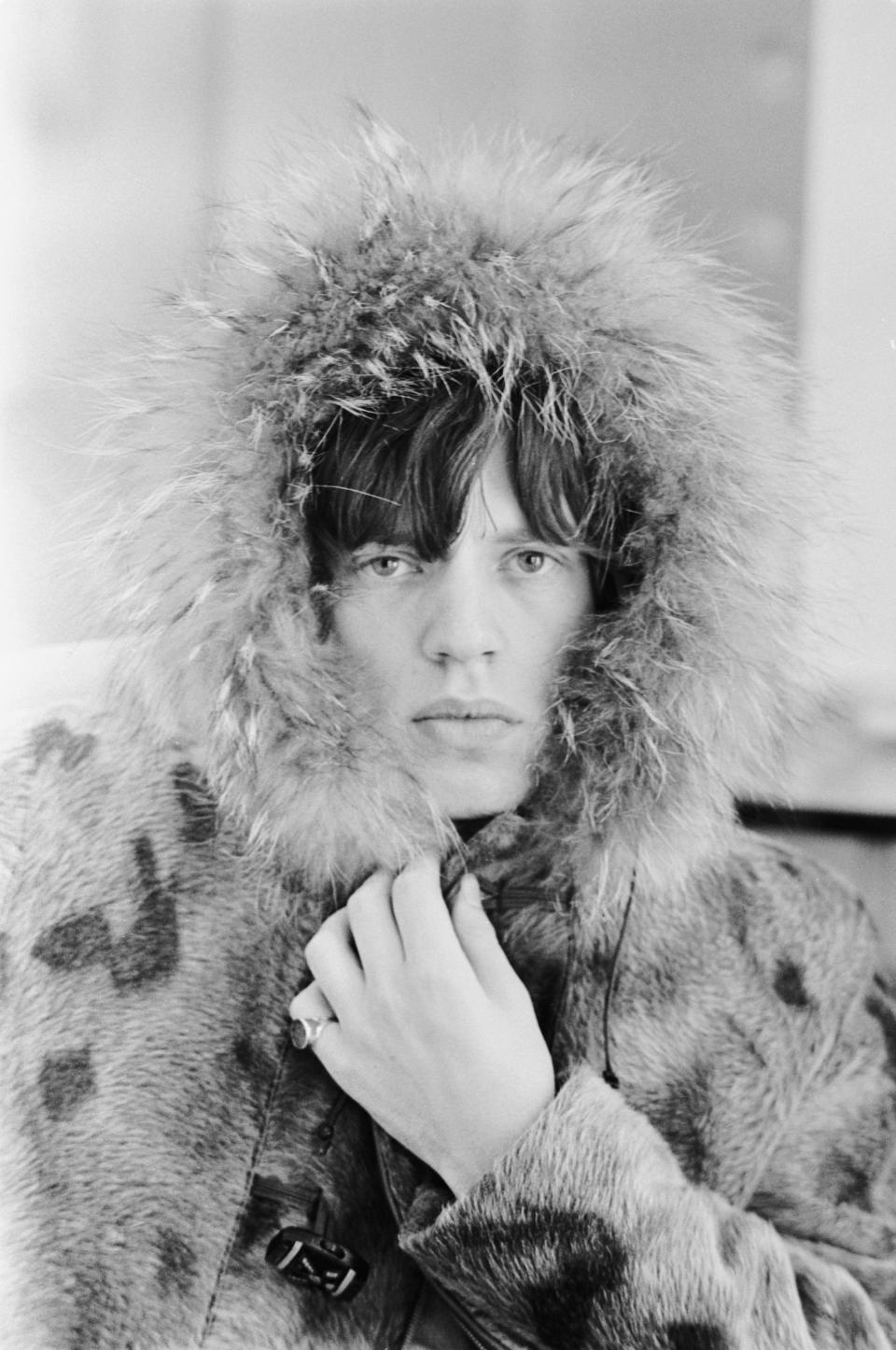 Mick Jagger, lead singer of the Rolling Stones, wearing a fur-lined parka, 1965. (Photo by Terry O'Neill/Hulton Archive/Getty Images)