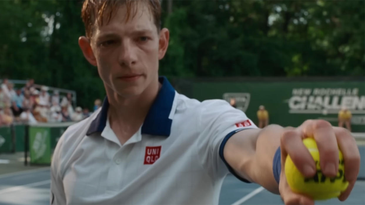  Mike Faist holds a ball in Challengers. 