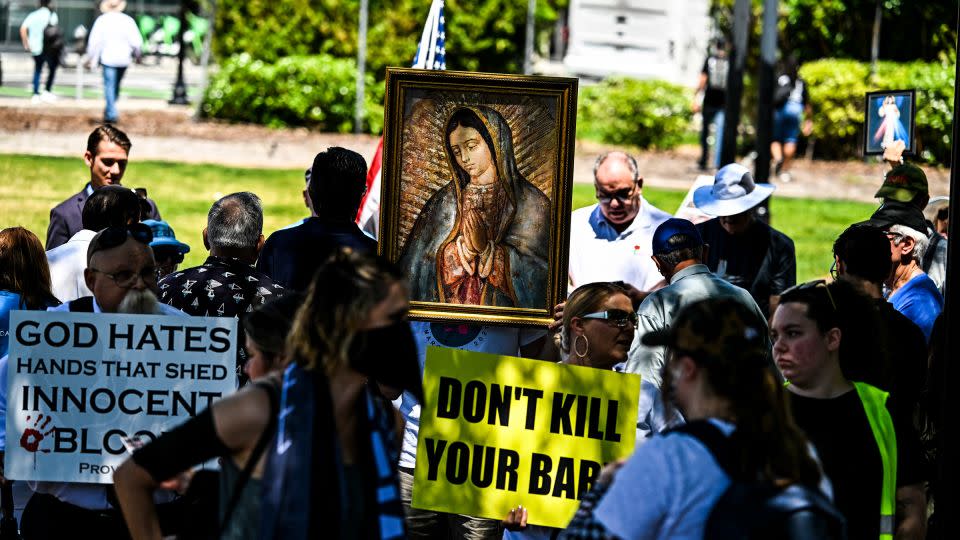 Anti-abortion activists counter-protest near a rally to protect abortion rights in Orlando, Florida, on April 13, 2024. - Chandan Khanna/AFP/Getty Images