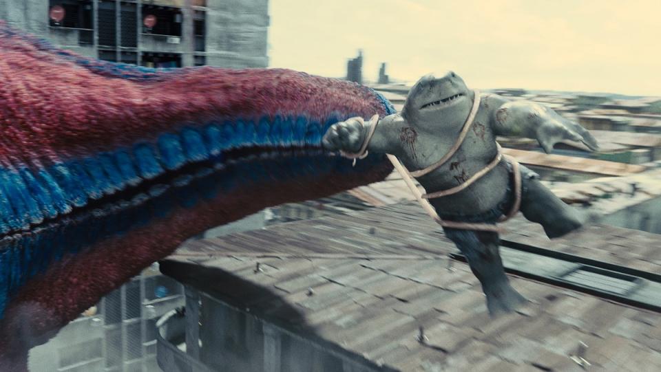 King Shark gets flung around by Starro's tendril in The Suicide Squad.