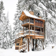 exterior of the treehouse in the snow