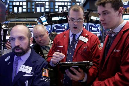 Traders work on the floor of the New York Stock Exchange (NYSE) in New York City, U.S., December 16, 2016. REUTERS/Brendan McDermid