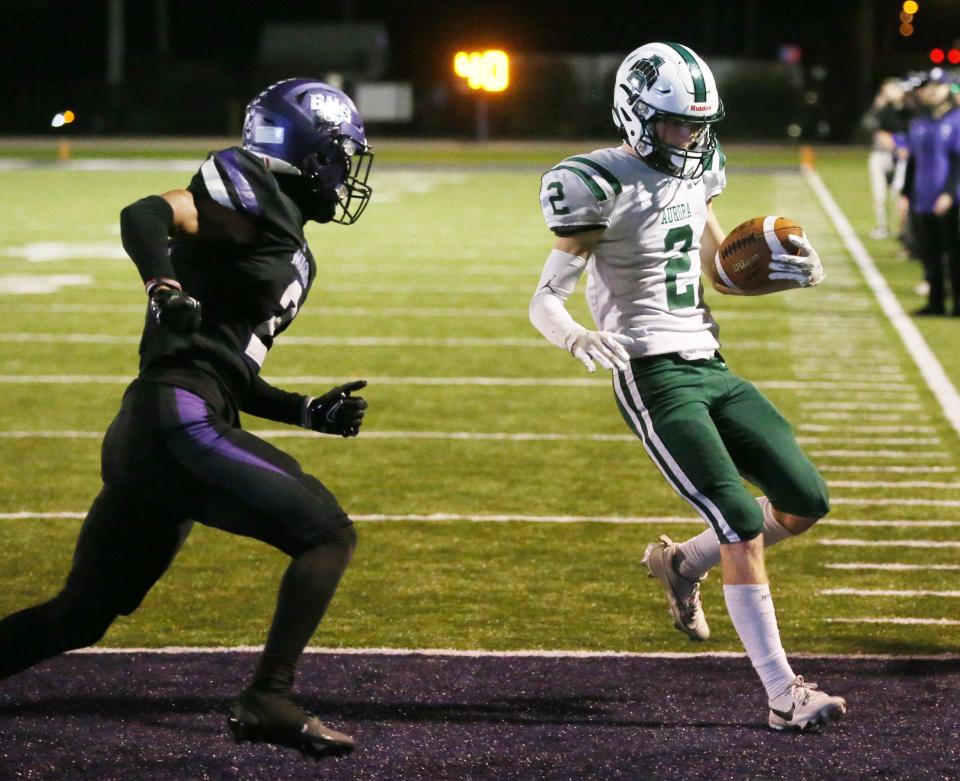 Barberton's Kenneth Larry closes in as Aurora's Ben Lukasik scores a first-half TD, Friday, Oct. 13, 2023.