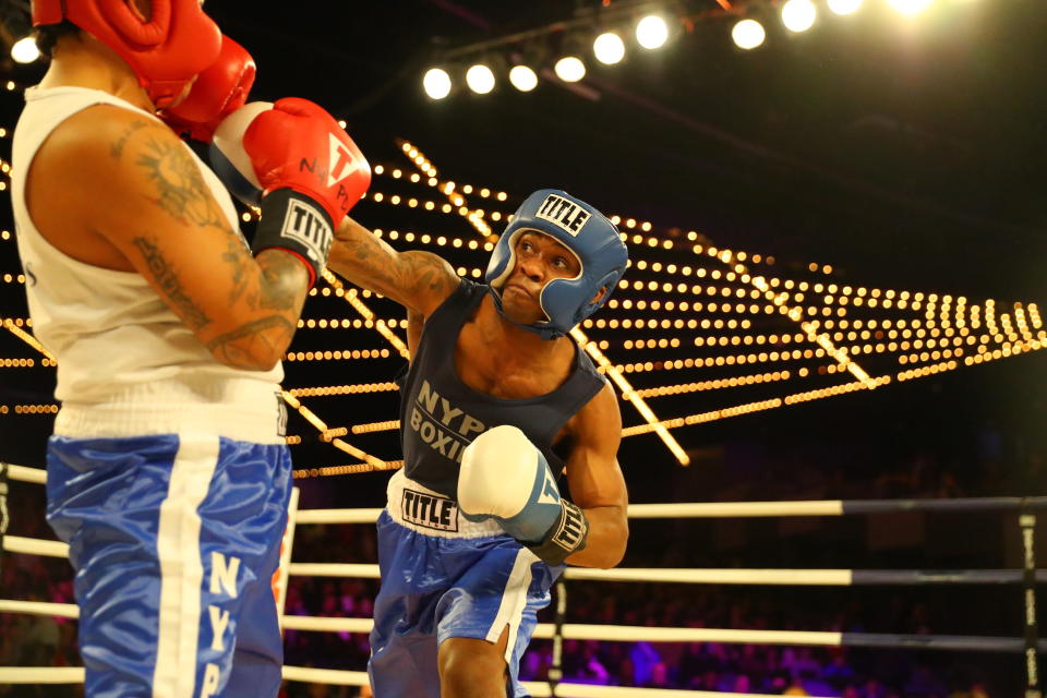 <p>John Chalen (red) battles Reshawn Merrick (blue) in Bronx Precinct Callout during the NYPD Boxing Championships at the Hulu Theater at Madison Square Garden on March 15, 2018. (Gordon Donovan/Yahoo News) </p>