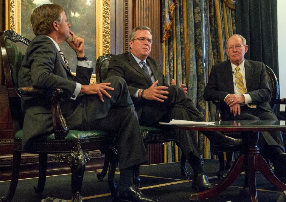 Former Florida Gov. Jeb Bush, center, speaks at an education forum with Tennessee Gov. Bill Haslam, left, and U.S. Sen. Lamar Alexander, R-Tenn., in Nashville, Tenn., on Wednesday, March 19, 2014. Bush urged politicians to make the case to their constituents in favor of Common Core education standards. (AP Photos/Erik Schelzig)