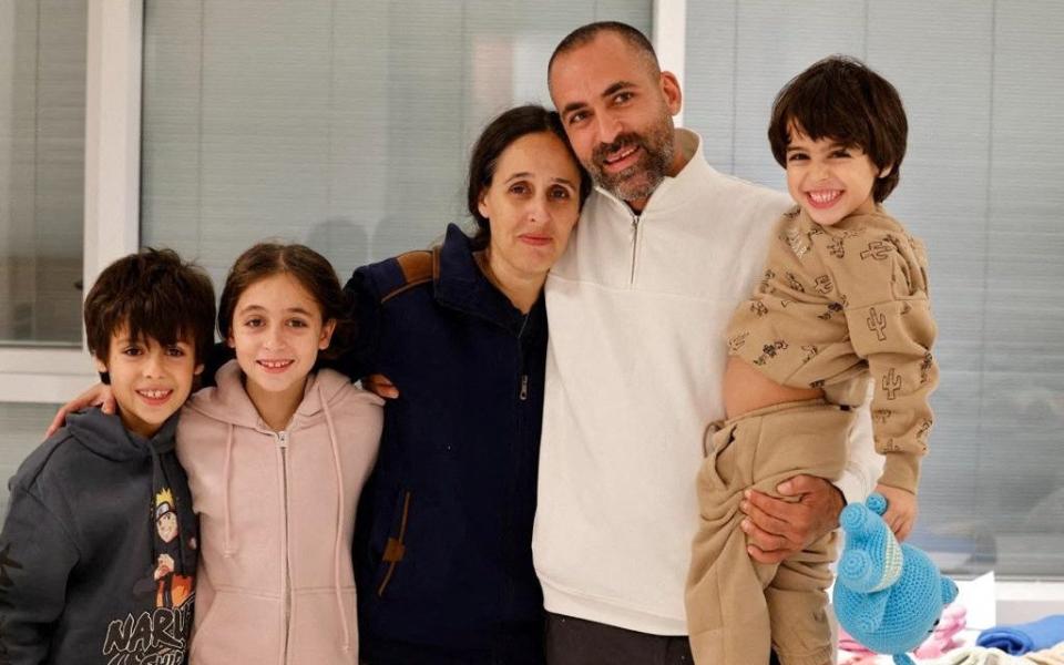 Avihai Brodutch poses with his wife Hagar Brodutch, 40, and their children shortly after they arrived in Israel on November 26 after being held hostage