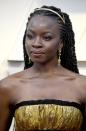 <p>A golden crown fit for a braided queen on <em>Black Panther</em>'s Danai Gurira. “Danai’s hairstyle was inspired by African Princess Royalty. I wanted to create something strong, regal, and elegant that complemented her dress along with her 1920's Fred Leighton headband so we went with gorgeous regal braids," said Larry Sims, a celebrity hairstylist who worked with Biolage.</p>