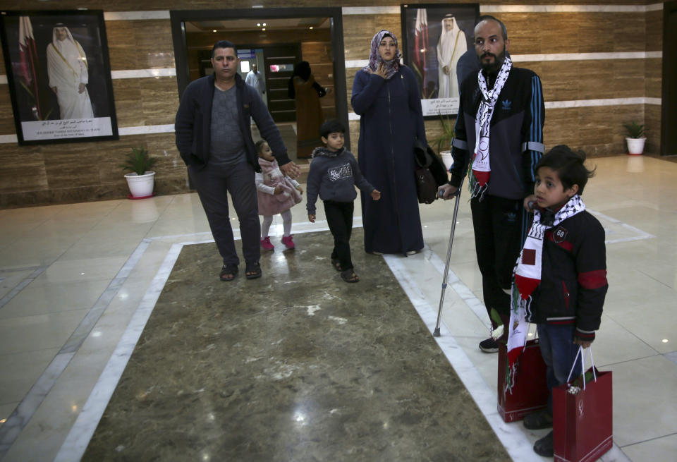 Palestinian patients walk in the hall after the opening ceremony of H. H. Sheikh Hamad bin Khalifa Al Thani Hospital for Rehabilitation and Artificial Limbs in Gaza City, Monday, April 22, 2019. Qatar built the hospital after its then-emir visited Gaza in 2012, but a lack of qualified staff and funding prevented Hamas from operating the center. (AP Photo/Adel Hana)