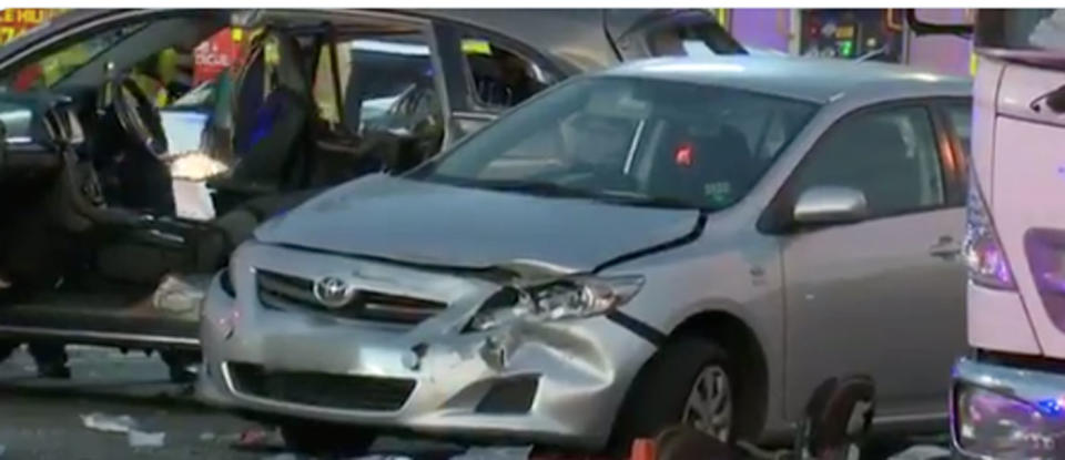 A young boy has been killed and a woman and girl left fighting for life after a Holden Commodore hit six stationary cars. Photo: 7 News