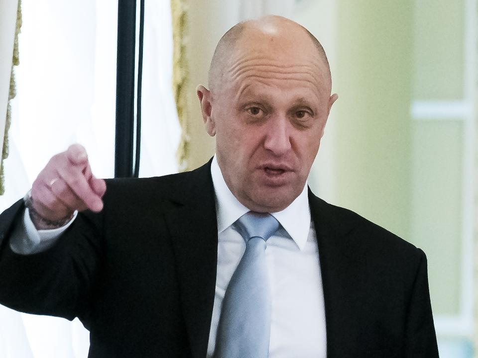 FILE - Yevgeny Prigozhin, left, gestures on the sidelines of a summit meeting between Russian President Vladimir Putin and Turkish President Recep Tayyip Erdogan at the Konstantin palace outside St. Petersburg, Russia, on Aug. 9, 2016. The State Department on July 22, 2022, offered a $10 million reward for information about Russian interference in American elections, including a close associate of Russian President Vladimir Putin and a troll farm that officials say fueled a divisive social media campaign in 2016. (AP Photo/Alexander Zemlianichenko, File)