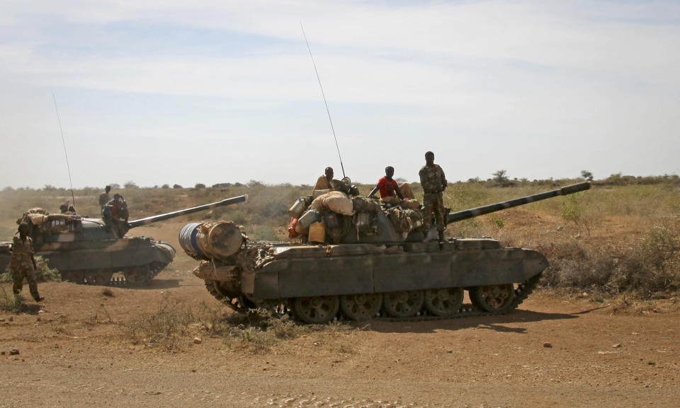 FILE - Ethiopian military tanks sit in position on the outskirts of the town of Baidoa in Somalia, Feb. 29, 2012. The al-Shabab extremist group has exploited Ethiopia's internal turmoil to cross the border from neighboring Somalia in unprecedented attacks in July 2022 that a top U.S. military commander has warned could continue. (AP Photo, File)