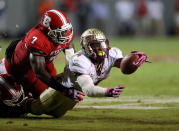 Sterling Lucas #7 of the North Carolina State Wolfpack stops Chris Thompson #4 of the Florida State Seminoles during their game at Carter-Finley Stadium on October 6, 2012 in Raleigh, North Carolina. (Photo by Streeter Lecka/Getty Images)