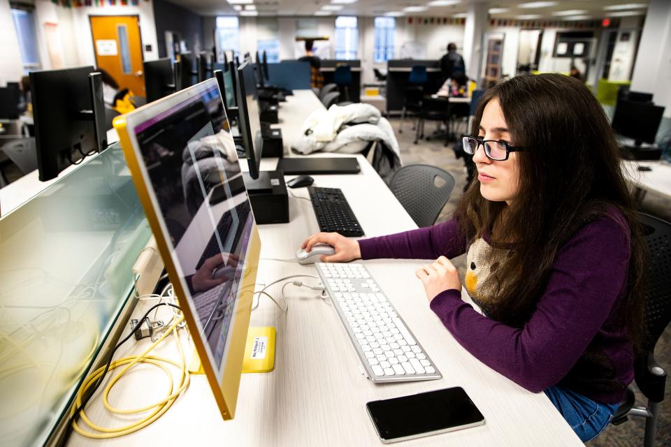 Ani Jilavyan works on a project during an Iowa Intersections meeting, Monday, Dec. 5, 2022, at Phillips Hall on the University of Iowa campus in Iowa City, Iowa.