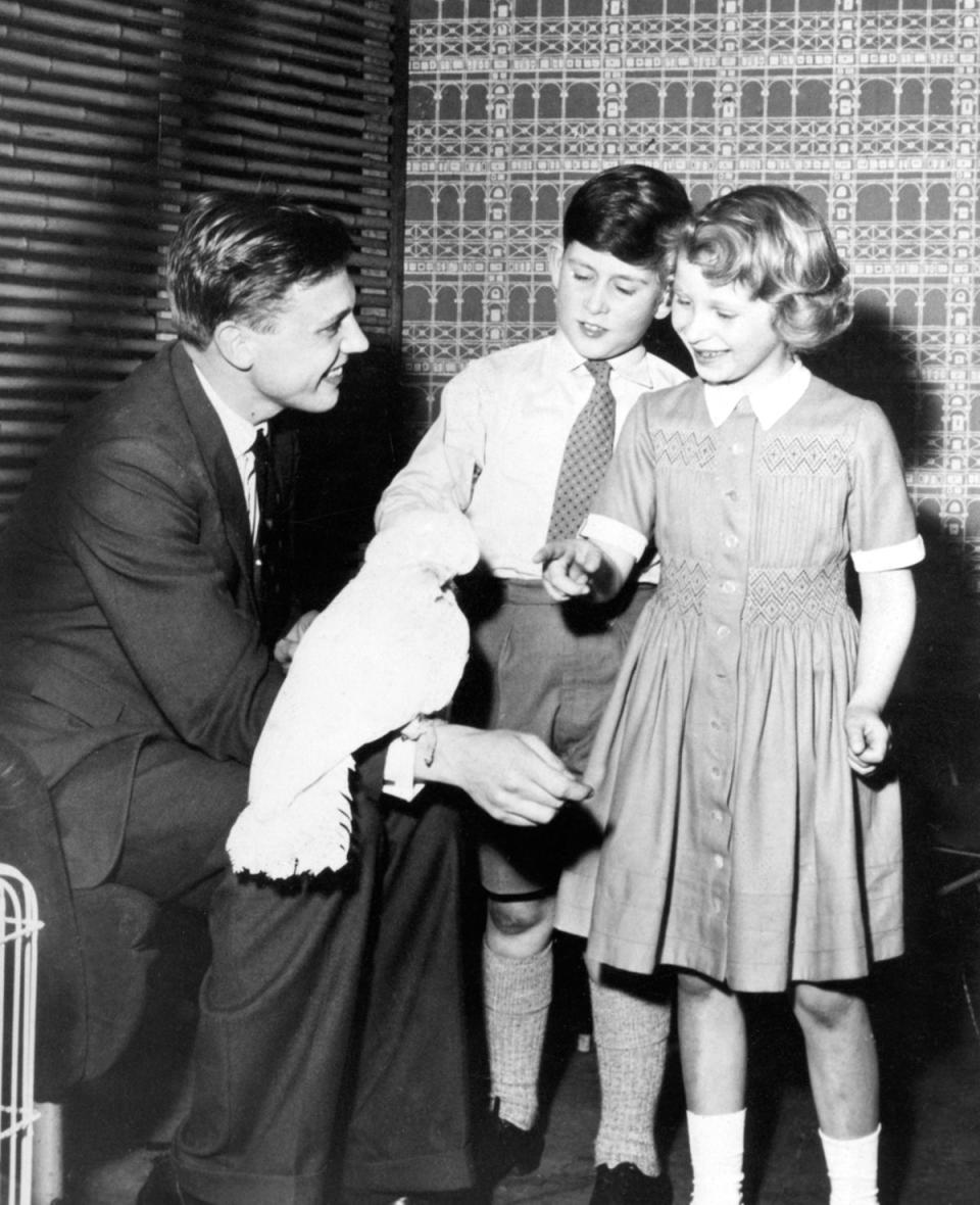 Royal visit: Prince Charles with his sister Princess Anne meeting Sir David Attenborough and Cocky, the cockatoo brought back from his last Zoo Quest expedition, at the BBC Television Studios in Lime Grove, London in 1958 (PA)