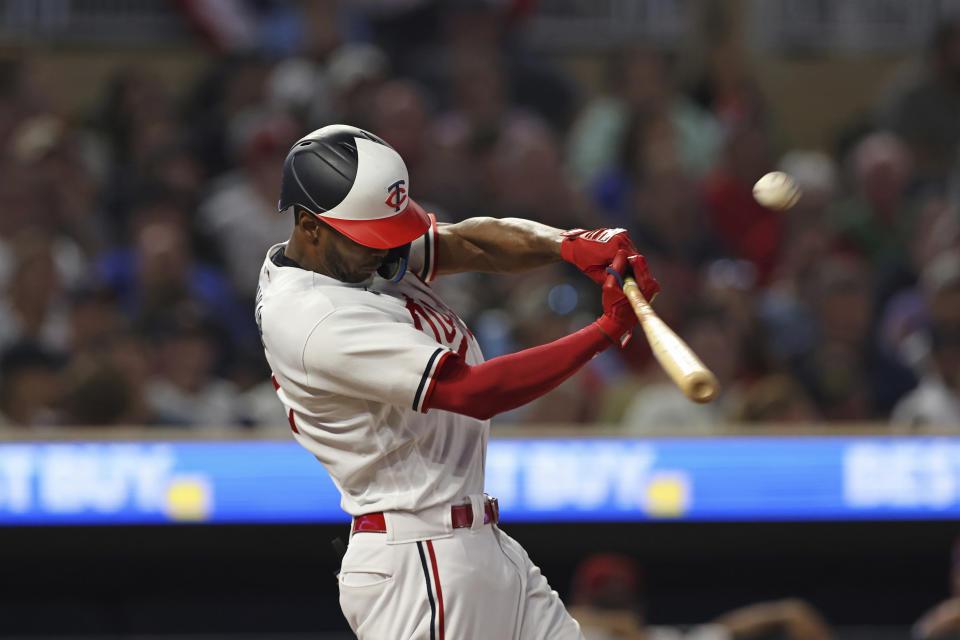 Minnesota Twins' Michael A. Taylor hits a home run against the Arizona Diamondbacks during the seventh inning of a baseball game Friday, Aug. 4, 2023, in Minneapolis. (AP Photo/Stacy Bengs)