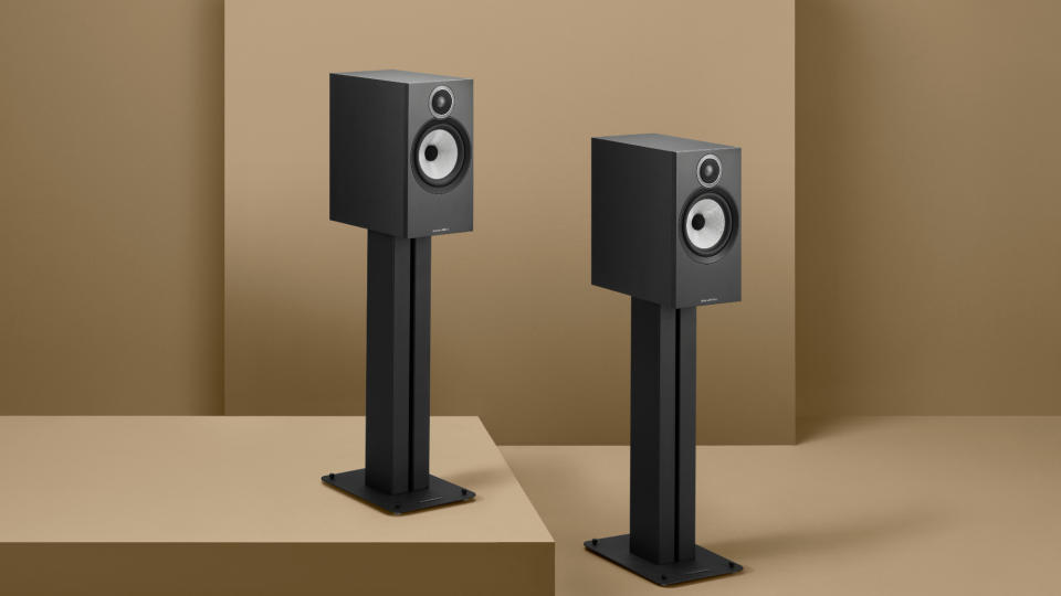 Bowers & Wilkins 606 S3 in black on stands a brown background