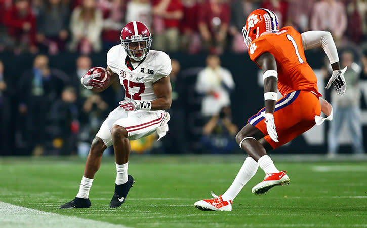 Minnesota Vikings safety, Jayron Kearse, then of the Clemson Tigers tackles Alabama Crimson Tide running back Kenyan Drake in the first quarter in the 2016 CFP National Championship at University of Phoenix Stadium.