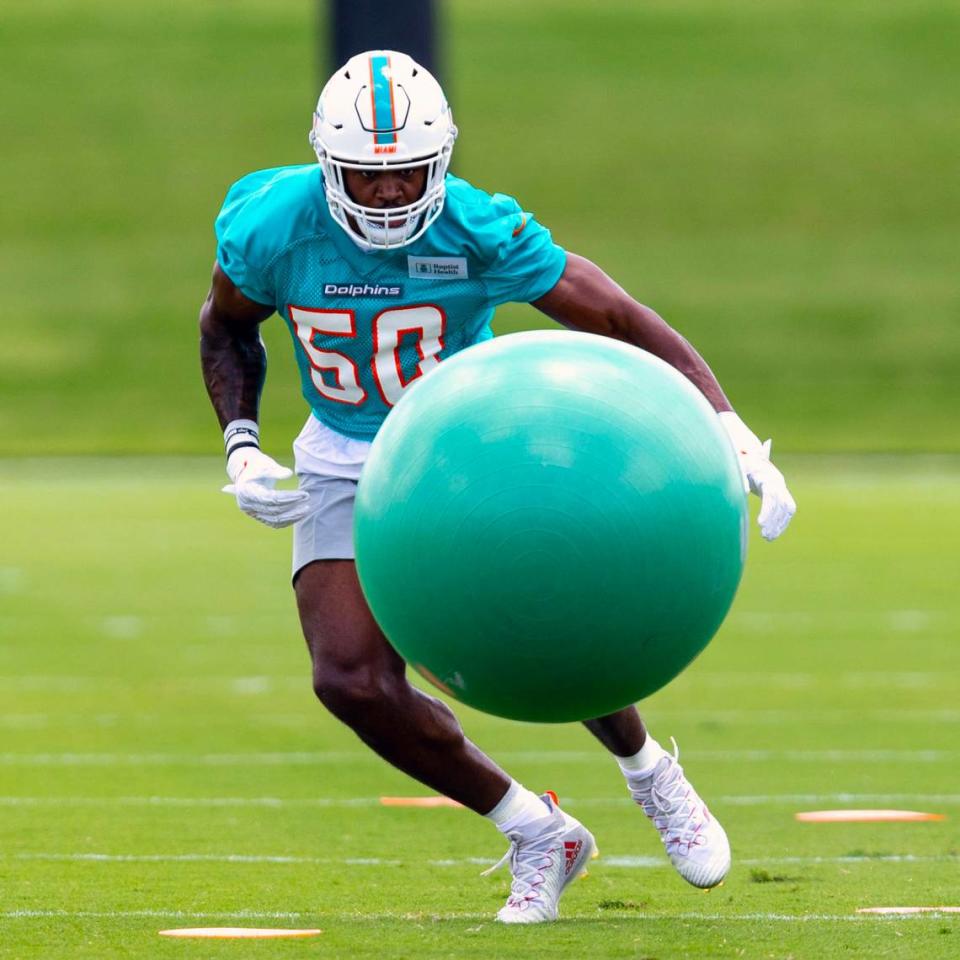 Rookie linebacker Mitchell Agude (50) runs through tackling drills during 2023 Miami Dolphins Rookie Minicamp practice at Baptist Health Training Complex in Miami Gardens, Florida, on Friday, May 12, 2023.